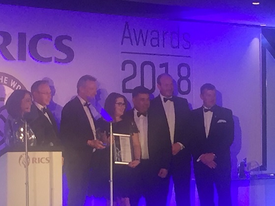 DMU campus win on stage WEB