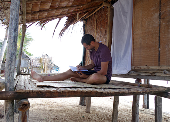 crivelli_hut1 working on veranda sm