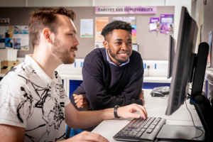 Two students working on a PC