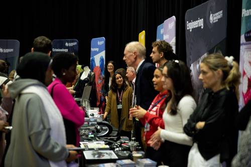 Students talking to DMU academics.