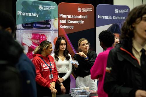 Students talking to current DMU students about science courses